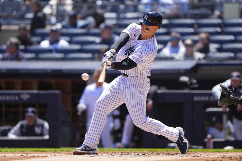 Apr 28, 2022; Bronx, New York, USA; New York Yankees first baseman Anthony Rizzo (48) hits a double against the Baltimore Orioles during the first inning at Yankee Stadium. Mandatory Credit: Gregory Fisher-USA TODAY Sports