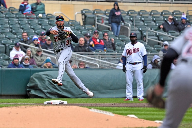 Apr 28, 2022; Minneapolis, Minnesota, USA;  Detroit Tigers shortstop Harold Castro (30) is charged with an error on this throw to first base against the Minnesota Twins during the second inning at Target Field. Mandatory Credit: Nick Wosika-USA TODAY Sports