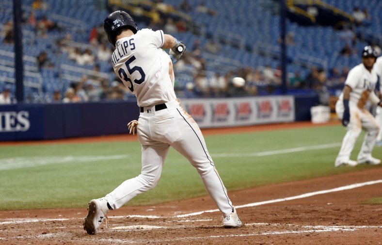 Apr 28, 2022; St. Petersburg, Florida, USA; Tampa Bay Rays right fielder Brett Phillips (35) hits a RBI single during the seventh inning against the Seattle Mariners at Tropicana Field. Mandatory Credit: Kim Klement-USA TODAY Sports