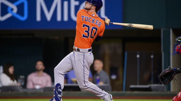 Apr 28, 2022; Arlington, Texas, USA; Houston Astros pinch hitter Kyle Tucker (30) hits a two run home run against the Texas Rangers during the eight inning at Globe Life Field. Mandatory Credit: Jerome Miron-USA TODAY Sports