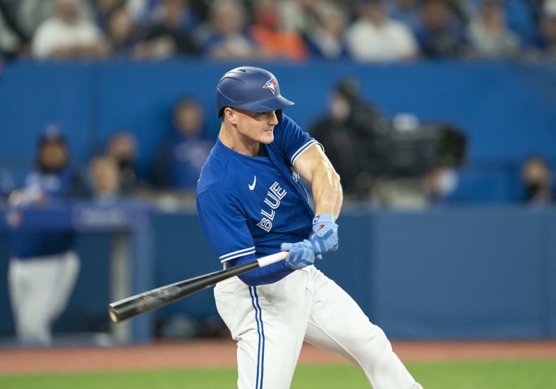 Apr 28, 2022; Toronto, Ontario, CAN; Toronto Blue Jays third baseman Matt Chapman (26) hits a double during the fifth inning against the Boston Red Sox at Rogers Centre. Mandatory Credit: Nick Turchiaro-USA TODAY Sports