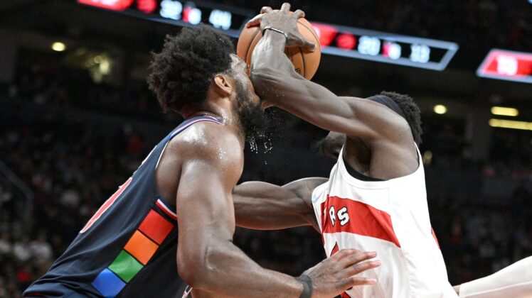 Apr 28, 2022; Toronto, Ontario, CAN;  Toronto Raptors forward Pascal Siakam (43) elbows Philadelphia 76ers center Joel Embiid (21) in the face as he drives to the basket during the second half of game six of the first round for the 2022 NBA playoffs at Scotiabank Arena. Mandatory Credit: Dan Hamilton-USA TODAY Sports