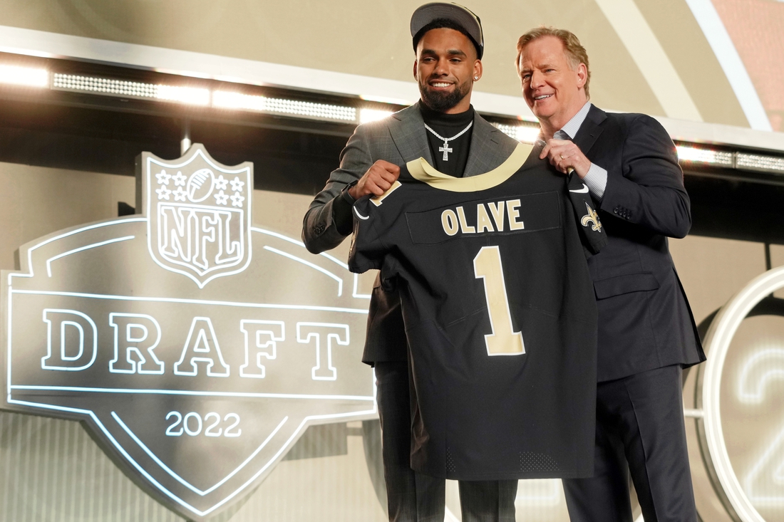 Apr 28, 2022; Las Vegas, NV, USA; Ohio State wide receiver Chris Olave with NFL commissioner Roger Goodell after being selected as the eleventh overall pick to the New Orleans Saints during the first round of the 2022 NFL Draft at the NFL Draft Theater. Mandatory Credit: Kirby Lee-USA TODAY Sports