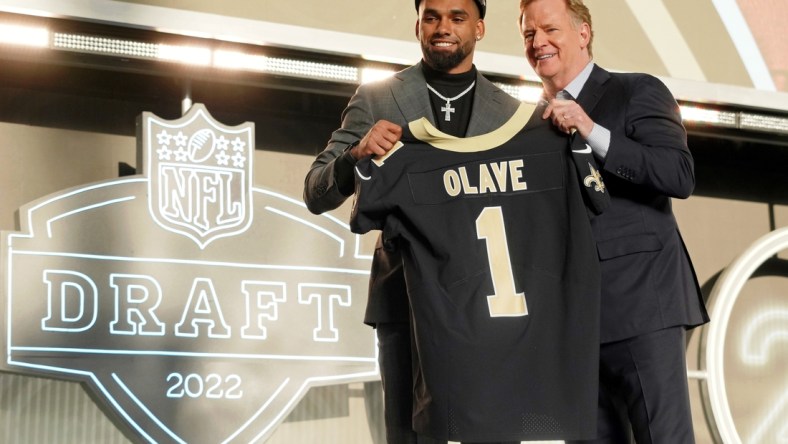 Apr 28, 2022; Las Vegas, NV, USA; Ohio State wide receiver Chris Olave with NFL commissioner Roger Goodell after being selected as the eleventh overall pick to the New Orleans Saints during the first round of the 2022 NFL Draft at the NFL Draft Theater. Mandatory Credit: Kirby Lee-USA TODAY Sports