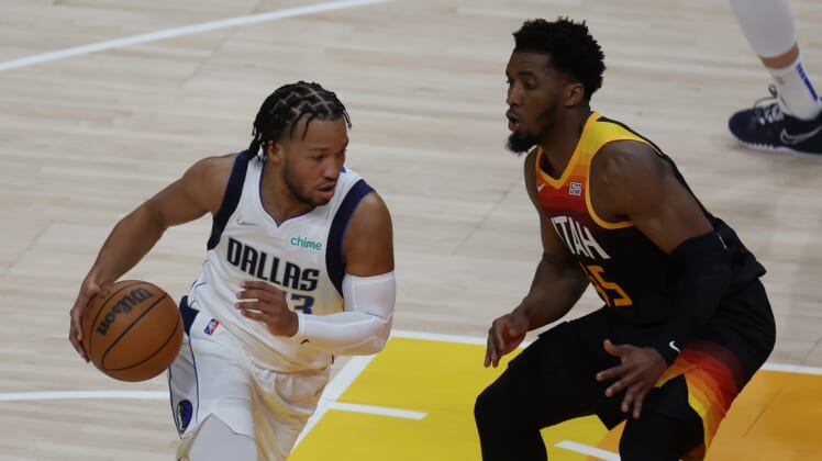 Apr 28, 2022; Salt Lake City, Utah, USA; Dallas Mavericks guard Jalen Brunson (13) drives the ball against Utah Jazz guard Donovan Mitchell (45) in the first quarter during game six of the first round for the 2022 NBA playoffs at Vivint Arena. Mandatory Credit: Rob Gray-USA TODAY Sports