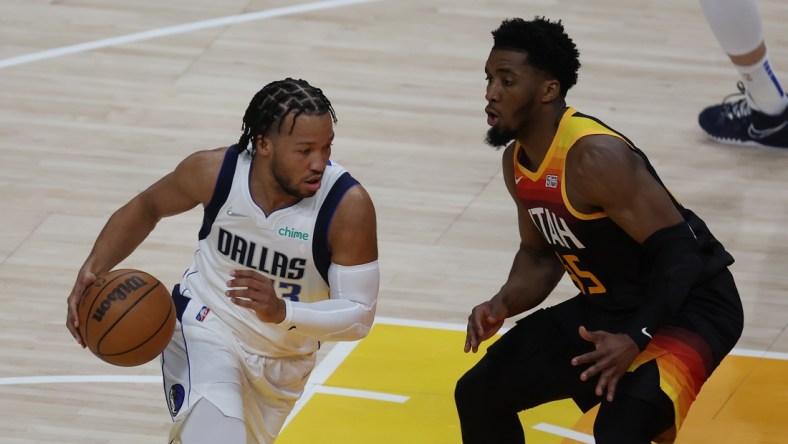 Apr 28, 2022; Salt Lake City, Utah, USA; Dallas Mavericks guard Jalen Brunson (13) drives the ball against Utah Jazz guard Donovan Mitchell (45) in the first quarter during game six of the first round for the 2022 NBA playoffs at Vivint Arena. Mandatory Credit: Rob Gray-USA TODAY Sports