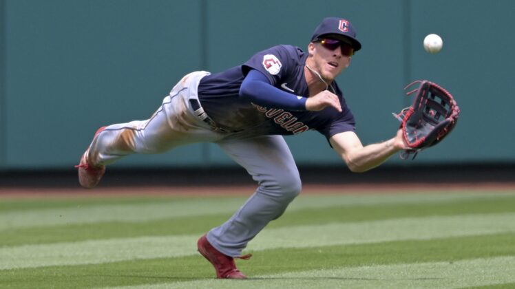 Apr 28, 2022; Anaheim, California, USA;  Cleveland Guardians center fielder Myles Straw (7) makes a diving catch off a ball hit by Los Angeles Angels right fielder Taylor Ward (3) in the first inning of the game at Angel Stadium. Mandatory Credit: Jayne Kamin-Oncea-USA TODAY Sports