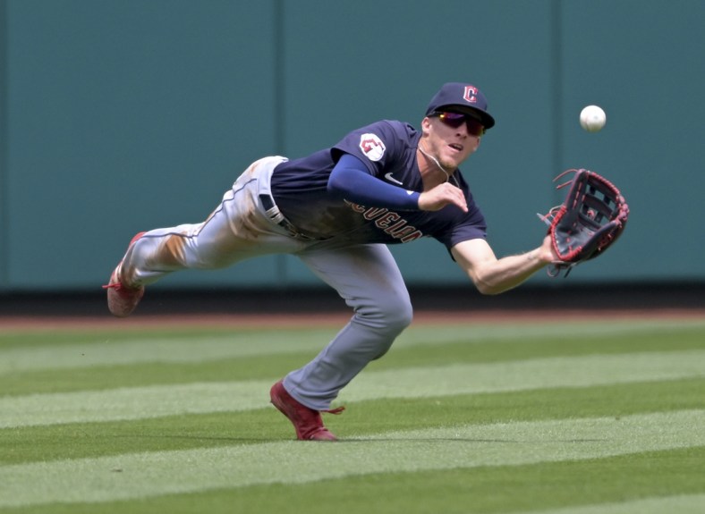 Apr 28, 2022; Anaheim, California, USA;  Cleveland Guardians center fielder Myles Straw (7) makes a diving catch off a ball hit by Los Angeles Angels right fielder Taylor Ward (3) in the first inning of the game at Angel Stadium. Mandatory Credit: Jayne Kamin-Oncea-USA TODAY Sports
