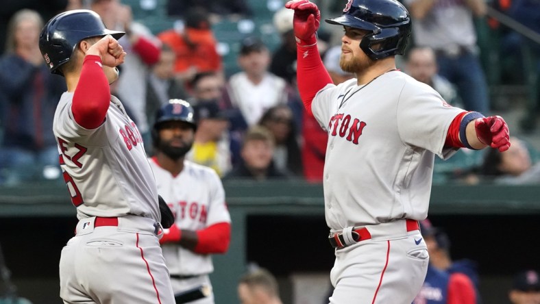 Apr 29, 2022; Baltimore, Maryland, USA; Boston Red Sox designated hitter Christian Arroyo (39) greeted by outfielder Enrique Hernandez (5) after his two run home run in the second inning against the Baltimore Orioles at Oriole Park at Camden Yards. Mandatory Credit: Mitch Stringer-USA TODAY Sports