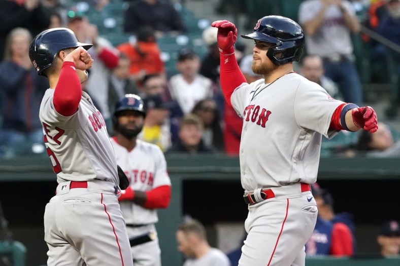 Apr 29, 2022; Baltimore, Maryland, USA; Boston Red Sox designated hitter Christian Arroyo (39) greeted by outfielder Enrique Hernandez (5) after his two run home run in the second inning against the Baltimore Orioles at Oriole Park at Camden Yards. Mandatory Credit: Mitch Stringer-USA TODAY Sports