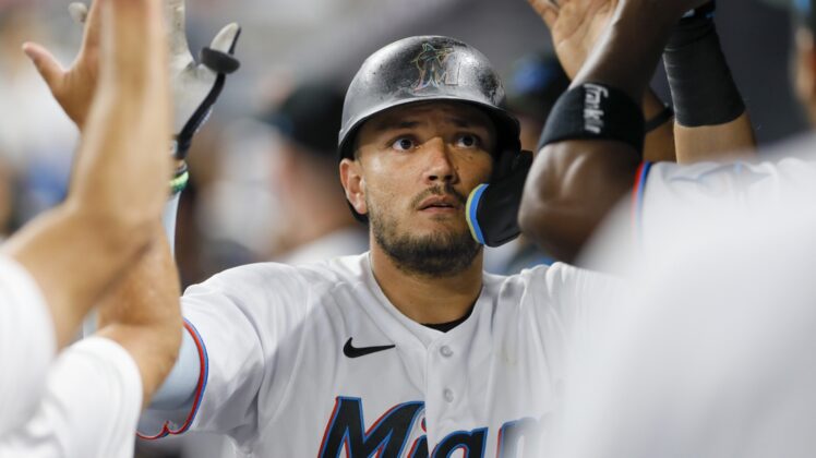 Apr 29, 2022; Miami, Florida, USA; Miami Marlins shortstop Miguel Rojas (11) celebrates after hitting a home run during the third inning against the Seattle Mariners at loanDepot Park. Mandatory Credit: Sam Navarro-USA TODAY Sports