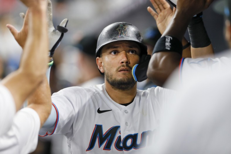 Apr 29, 2022; Miami, Florida, USA; Miami Marlins shortstop Miguel Rojas (11) celebrates after hitting a home run during the third inning against the Seattle Mariners at loanDepot Park. Mandatory Credit: Sam Navarro-USA TODAY Sports
