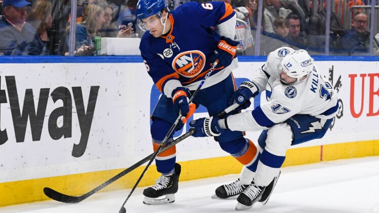 Apr 29, 2022; Elmont, New York, USA; Tampa Bay Lightning left wing Alex Killorn (17) attempts to steal the puck from New York Islanders defenseman Ryan Pulock (6) during the first period at UBS Arena. Mandatory Credit: Dennis Schneidler-USA TODAY Sports