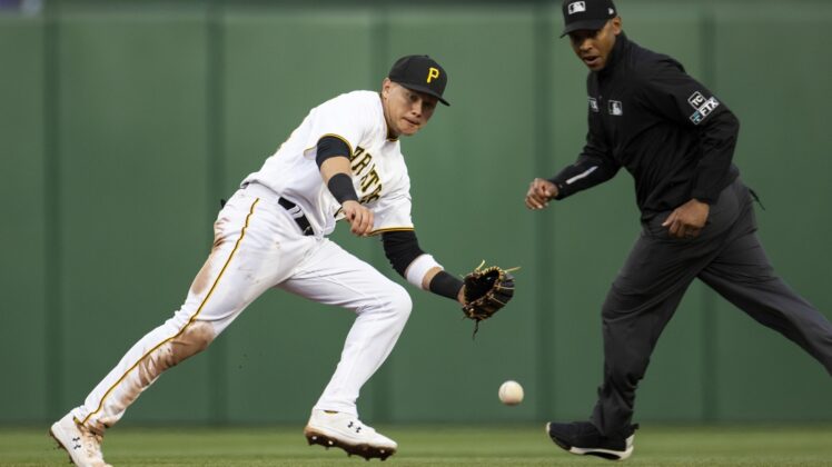 Apr 29, 2022; Pittsburgh, Pennsylvania, USA; Pittsburgh Pirates shortstop Diego Castillo (64) fields a ball during the third inning against the San Diego Padres at PNC Park. Mandatory Credit: Scott Galvin-USA TODAY Sports