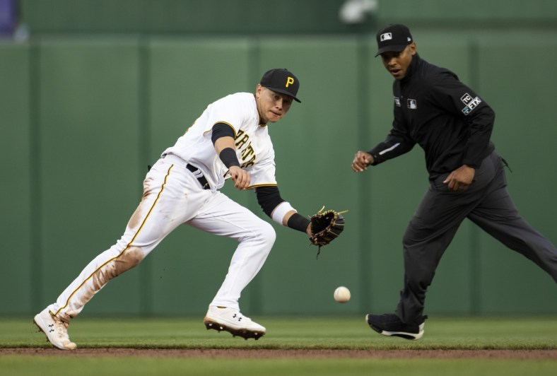 Apr 29, 2022; Pittsburgh, Pennsylvania, USA; Pittsburgh Pirates shortstop Diego Castillo (64) fields a ball during the third inning against the San Diego Padres at PNC Park. Mandatory Credit: Scott Galvin-USA TODAY Sports
