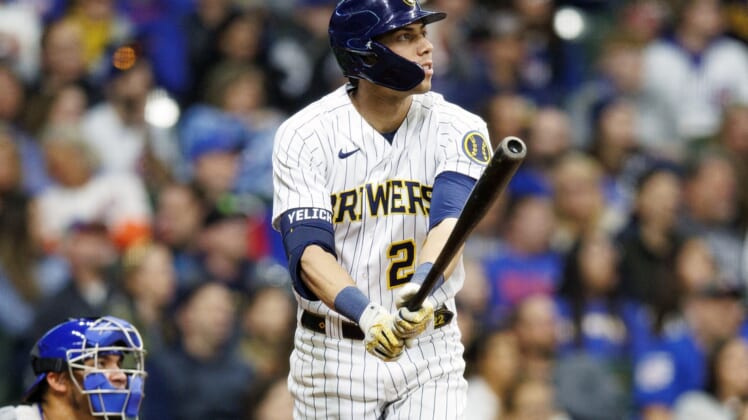 Apr 29, 2022; Milwaukee, Wisconsin, USA;  Milwaukee Brewers left fielder Christian Yelich (22) watches his two run home run during the fifth inning against. the Chicago Cubs at American Family Field. Mandatory Credit: Jeff Hanisch-USA TODAY Sports
