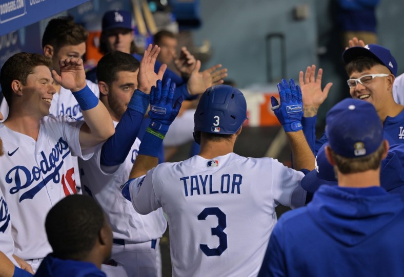 Apr 29, 2022; Los Angeles, California, USA; Los Angeles Dodgers designated hitter Chris Taylor (3) is greeted in the dugout after hitting a solo home run in the second inning against the Detroit Tigers at Dodger Stadium. Mandatory Credit: Jayne Kamin-Oncea-USA TODAY Sports