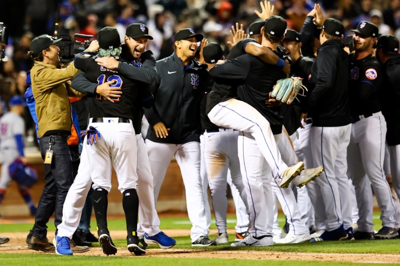 Apr 29, 2022; New York City, New York, USA; New York Mets shortstop Francisco Lindor (12) and starting pitcher Max Scherzer (21) celebrate a combined no-hitter with other teammates after a game against the Philadelphia Phillies at Citi Field. Mandatory Credit: Jessica Alcheh-USA TODAY Sports