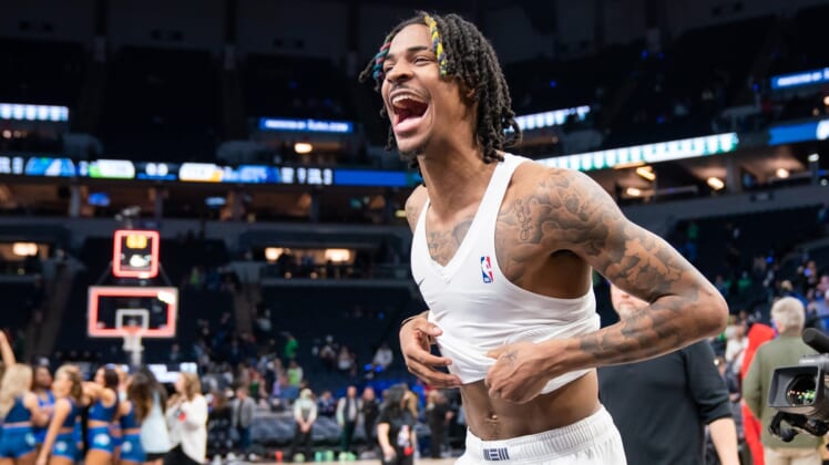 Apr 29, 2022; Minneapolis, Minnesota, USA; Memphis Grizzlies guard Ja Morant (12) celebrates after the game against the Minnesota Timberwolves after game six of the first round for the 2022 NBA playoffs at Target Center. Mandatory Credit: Brad Rempel-USA TODAY Sports