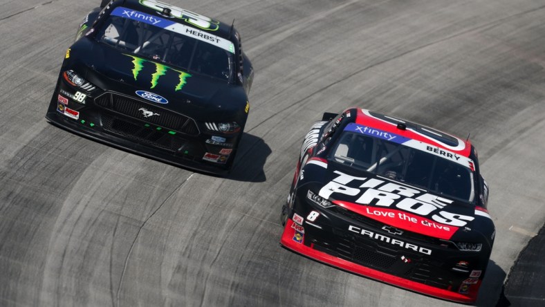 Apr 30, 2022; Dover, Delaware, USA; NASCAR Xfinity Series driver Josh Berry (8) races driver Riley Herbst (98) during the A-Game 200 at Dover Motor Speedway. Mandatory Credit: Matthew OHaren-USA TODAY Sports