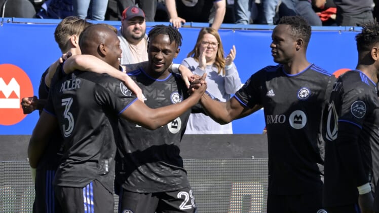 Apr 30, 2022; Montreal, Quebec, CAN; CF Montreal defender Kamal Miller (3) reacts with teammates including midfielder Romell Quioto (30) after scoring a goal against Atlanta United FC during the first half at Stade Saputo. Mandatory Credit: Eric Bolte-USA TODAY Sports