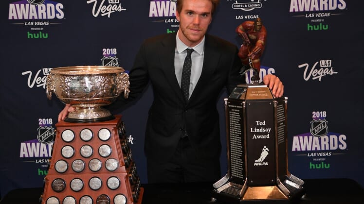 Jun 20, 2018; Las Vegas, NV, USA; Connor McDavid poses with the Art Ross and Ted Lindsay awards during the 2018 NHL Awards at Hard Rock Hotel and Casino. Mandatory Credit: Stephen R. Sylvanie-USA TODAY Sports
