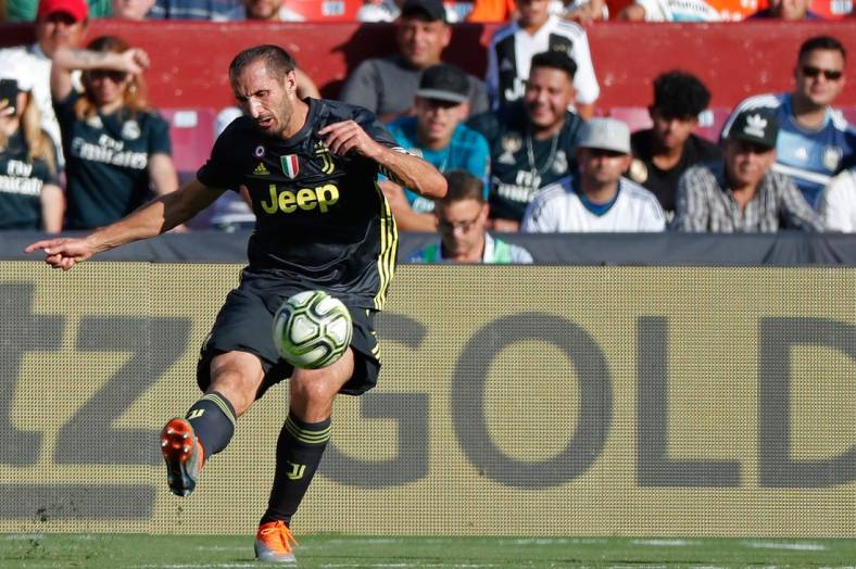 Aug 4, 2018; Landover, MD, USA; Juventus defender Giorgio Chiellini (3) kicks the ball against Real Madrid during an International Champions Cup soccer match at FedEx Field. Mandatory Credit: Geoff Burke-USA TODAY Sports