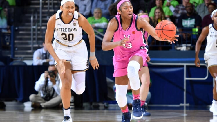 Mar 3, 2019; South Bend, IN, USA; Virginia Cavaliers guard Jocelyn Willoughby (13) grabs a loose ball as Notre Dame Fighting Irish center Mikayla Vaughn (30) pursues in the first half at the Purcell Pavilion. Mandatory Credit: Matt Cashore-USA TODAY Sports