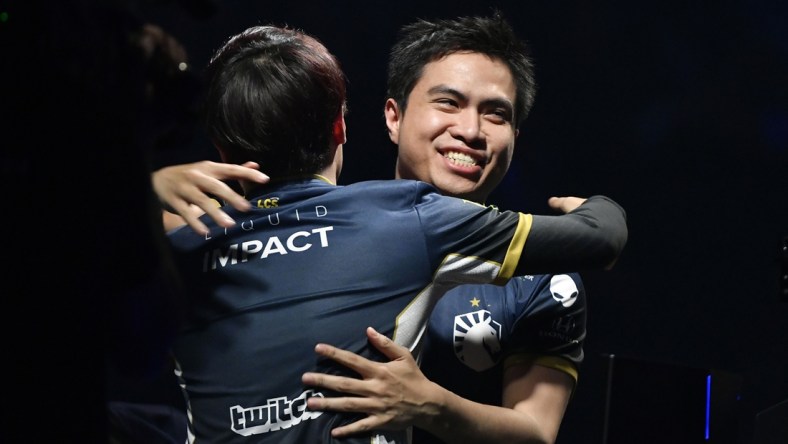 Apr 13, 2019; St. Louis , MO, USA; Team Liquid member Jake Puchero hugs Eonyoung Jeong after defeating TSM in the fifth game to win the League of Legends Championship Series Spring Finals at Chaifetz Arena. Mandatory Credit: Jeff Curry-USA TODAY Sports