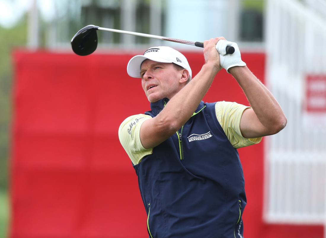 Steve Stricker watches the flight of his ball after teeing off on the 1st hole.

Steve Stricker Senior Pga A