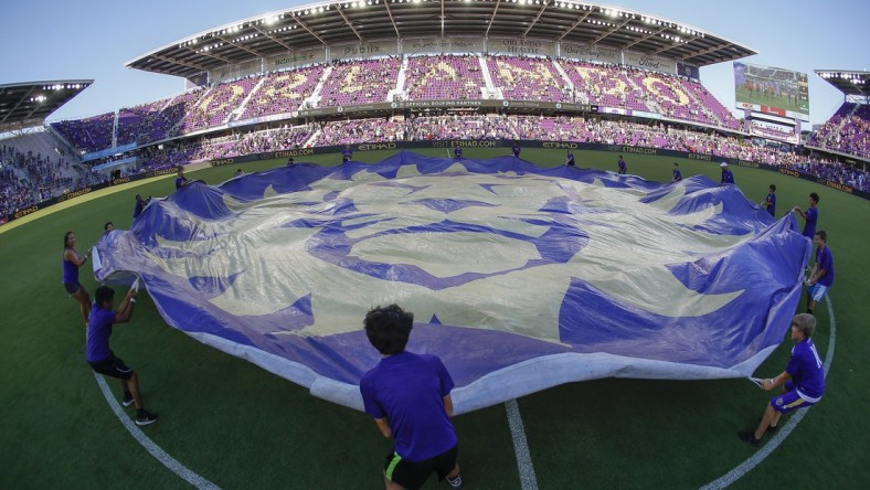 May 24, 2019; Orlando, FL, USA; Orlando City FC fan kids wave the team logo banner at mid field before a match against the Los Angeles Galaxy  at Orlando City Stadium. Mandatory Credit: Reinhold Matay-USA TODAY Sports