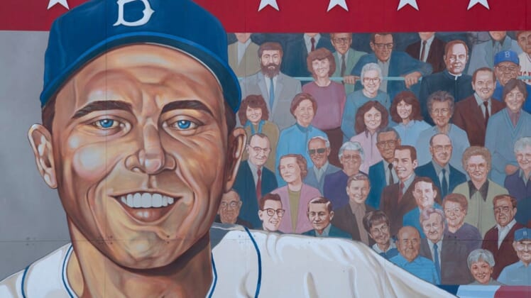 A 52' x 16' mural of Gil Hodges, painted by Randy Hedden, stands at the corner of Hwy 61 and Hwy 57 in Petersburg, Ind., Hodges' hometown. Hodges is portrayed as a player for the Brooklyn Dodgers (part of two World Series winning Dodgers teams     1955 in Brooklyn and 1959 in Los Angeles) and manager for the New York Mets (captained the Miracle Mets to their first-ever World Series title in 1969).Ds82819gilhodges001