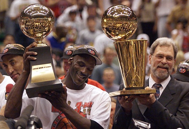 Michael Jordan and Phil Jackson celebrate after finishing off the Jazz to win the 1998 championship.

2020-04-16 Jordan Jackson