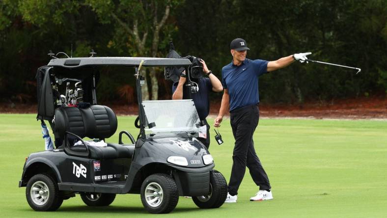 May 24, 2020; Hobe Sound, FL, USA; NFL player Tom Brady of the Tampa Bay Buccaneers reacts after holing out from the fairway on the seventh during The Match: Champions for Charity golf round at the Medalist Golf Club.  Mandatory Credit: Handout Photo by Getty Images for The Match via USA TODAY Sports