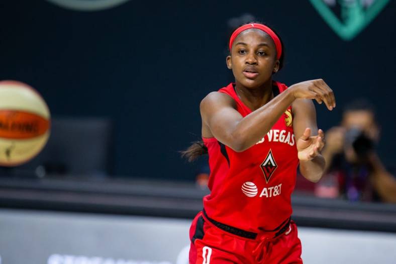Sep 24, 2020; Bradenton, Florida, USA; Las Vegas Aces guard Jackie Young (0) passes during game 3 of the WNBA semi-finals at Feld Entertainment. Mandatory Credit: Mary Holt-USA TODAY Sports