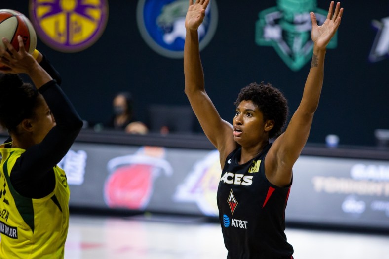 Oct 2, 2020; Bradenton, Florida, USA; Las Vegas Aces forward Angel McCoughtry (35) defends against an inbound pass from Seattle Storm forward Alysha Clark (32) during game 1 of the WNBA finals at IMG Academy. Mandatory Credit: Mary Holt-USA TODAY Sports