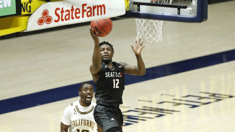 Dec 22, 2020; Berkeley, California, USA;  Seattle Redhawks guard Darrion Trammell (12) scores past California Golden Bears guard Makale Foreman (10) during the first half at Haas Pavilion. Mandatory Credit: Darren Yamashita-USA TODAY Sports