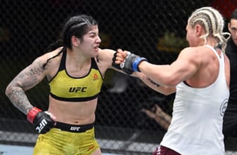 Feb 20, 2021; Las Vegas, NV, USA;  Ketlen Vieira of Brazil punches Yana Kunitskaya of Russia in a bantamweight bout during the UFC Fight Night event at UFC APEX on February 20, 2021 in Las Vegas, Nevada.  Mandatory Credit: Chris Unger/Handout Photo via USA TODAY Sports