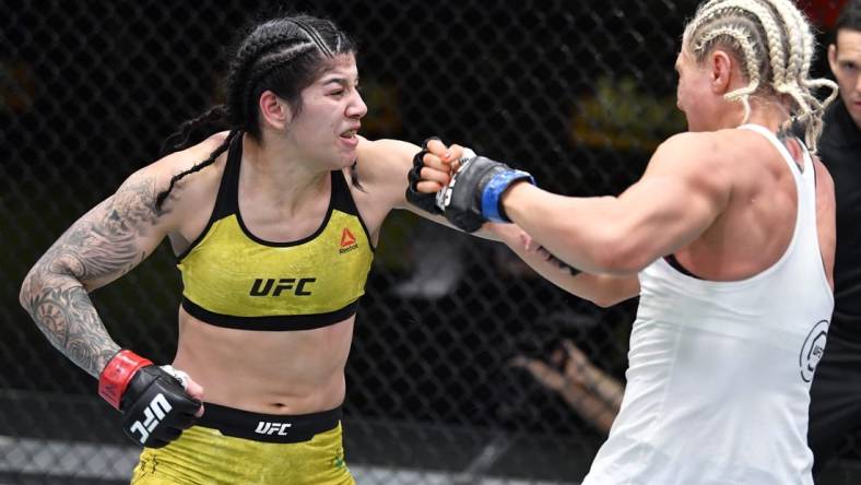 Feb 20, 2021; Las Vegas, NV, USA;  Ketlen Vieira of Brazil punches Yana Kunitskaya of Russia in a bantamweight bout during the UFC Fight Night event at UFC APEX on February 20, 2021 in Las Vegas, Nevada.  Mandatory Credit: Chris Unger/Handout Photo via USA TODAY Sports