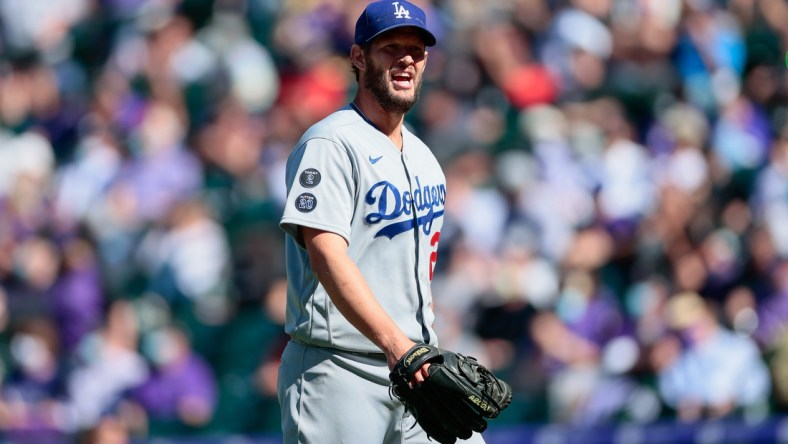 Apr 1, 2021; Denver, Colorado, USA; Los Angeles Dodgers starting pitcher Clayton Kershaw (22) reacts as he walks to the dugout at the end of the third inning against the Colorado Rockies at Coors Field. Mandatory Credit: Isaiah J. Downing-USA TODAY Sports