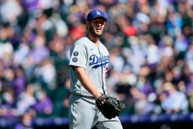 Apr 1, 2021; Denver, Colorado, USA; Los Angeles Dodgers starting pitcher Clayton Kershaw (22) reacts as he walks to the dugout at the end of the third inning against the Colorado Rockies at Coors Field. Mandatory Credit: Isaiah J. Downing-USA TODAY Sports