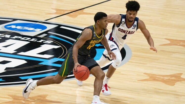 April 5, 2021; Indianapolis, IN, USA; Baylor Bears guard Jared Butler (12) dribbles the basketball against Gonzaga Bulldogs guard Aaron Cook (4) in the second half during the national championship game in the Final Four of the 2021 NCAA Tournament at Lucas Oil Stadium. Mandatory Credit: Kyle Terada-USA TODAY Sports