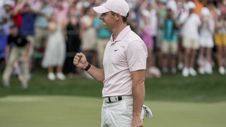 May 9, 2021; Charlotte, North Carolina, USA; Rory McIlroy gives a fist bump after securing his third Wells Fargo championship during the final round of the Wells Fargo Championship golf tournament. Mandatory Credit: Jim Dedmon-USA TODAY Sports