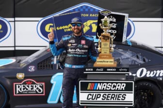 May 9, 2021; Darlington, South Carolina, USA; NASCAR Cup Series driver Martin Truex Jr. celebrates after winning the Goodyear 400 at Darlington Raceway. Mandatory Credit: Jasen Vinlove-USA TODAY Sports