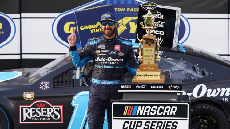 May 9, 2021; Darlington, South Carolina, USA; NASCAR Cup Series driver Martin Truex Jr. celebrates after winning the Goodyear 400 at Darlington Raceway. Mandatory Credit: Jasen Vinlove-USA TODAY Sports