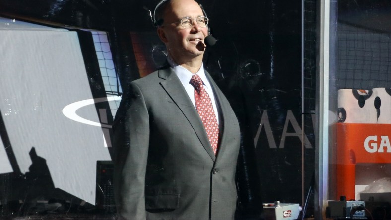 May 8, 2021; Pittsburgh, Pennsylvania, USA;  NBC network NHL hockey analyst Pierre McGuire reports from between the bench before the Pittsburgh Penguins host the Buffalo Sabres at PPG Paints Arena. Mandatory Credit: Charles LeClaire-USA TODAY Sports