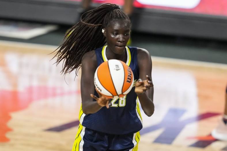 May 27, 2021; College Park, Georgia, USA; Dallas Wings center Awak Kuier (28) passes the ball against the Atlanta Dream during the first half at Gateway Center Arena at College Park. Mandatory Credit: Dale Zanine-USA TODAY Sports