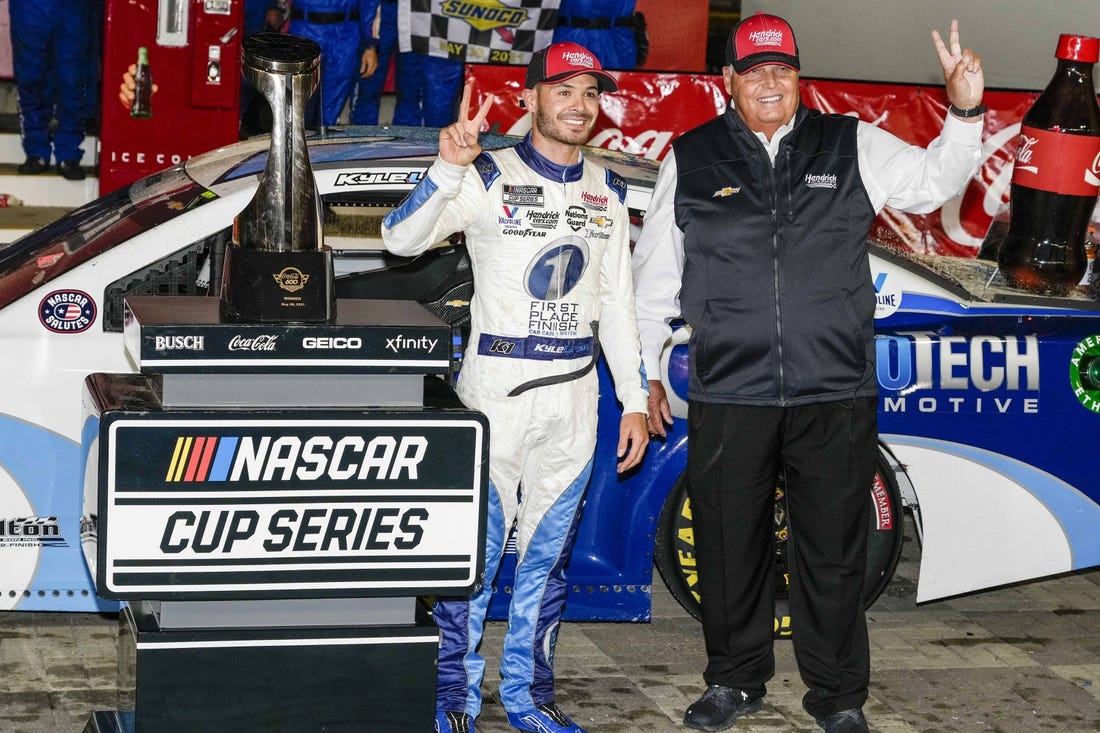 May 30, 2021; Concord, North Carolina, USA;  NASCAR Cup Series driver Kyle Larson (5) celebrates his win with team owner Rick Hendrick at the Coca-Cola 600 at Charlotte Motor Speedway. Mandatory Credit: Jim Dedmon-USA TODAY Sports