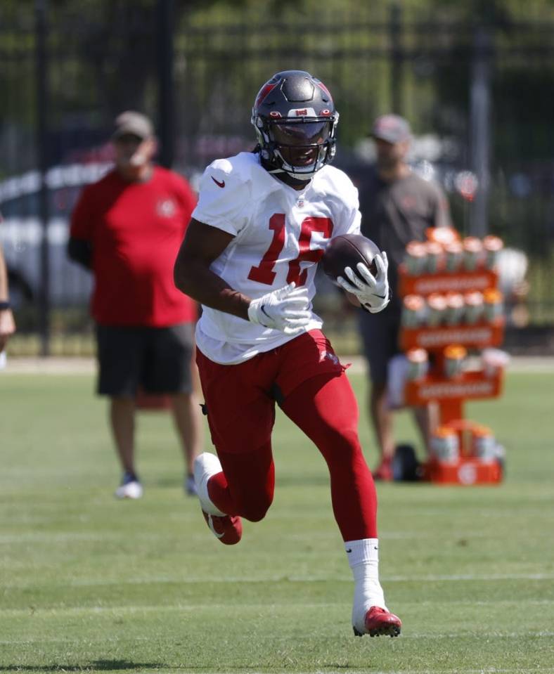 Jun 1, 2021; Tampa, FL, USA;  Tampa Bay Buccaneers wide receiver Travis Jonsen (16) runs with the ball during organized team activities at AdventHealth Training Center. Mandatory Credit: Kim Klement-USA TODAY Sports