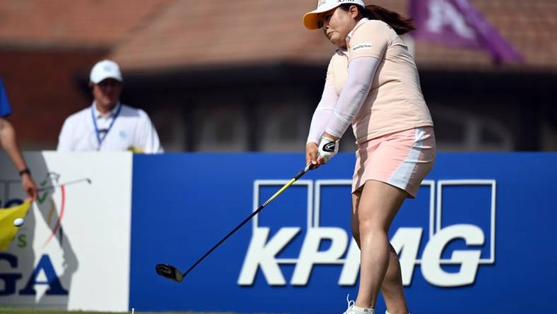 Jun 26, 2021; John's Creek, Georgia, USA; Inbee Park plays her shot from the first tee during the third round of the KPMG Women's PGA Championship golf tournament at the Atlanta Athletic Club. Mandatory Credit: Adam Hagy-USA TODAY Sports